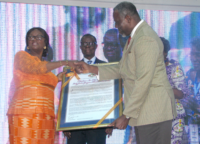 Mr Danny Easman Mawunyega (right), International Secretary Ghana, presenting a citation to Mrs Justice Georgina Theodora Wood, a  member of the Council of State and former Chief Justice 