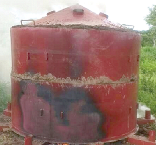 The kiln being fired for the production of charcoal