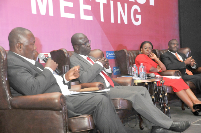 Mr Charles Osei Akoto (left) explaining a point at the Graphic Business/Stanbic Bank Breakfast Meet. Those with him are Mr Hayford Atta Krufi (2nd left), Ms Angela Gyasi (3rd left), and Mr Peter Osei Duah (right).