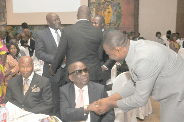  Mr James Asare-Adjei exchanging pleasantries with Mr Kan Dapaah, Minister of National Security and member of the Institute. With them is Mr Sam Okudjeto. Picture: EBOW HANSON