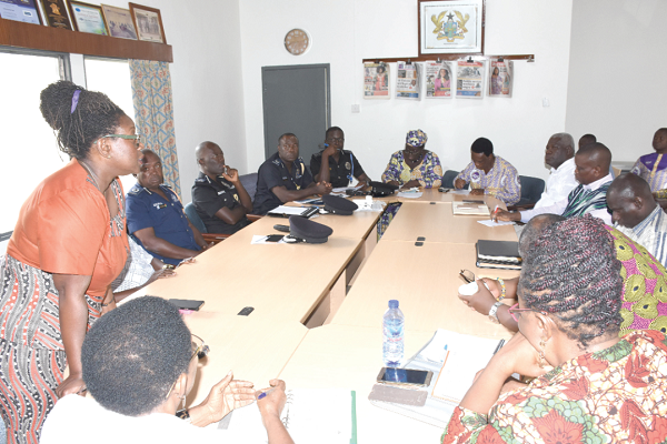 Ms Carol Annang (standing) addressing the meeting