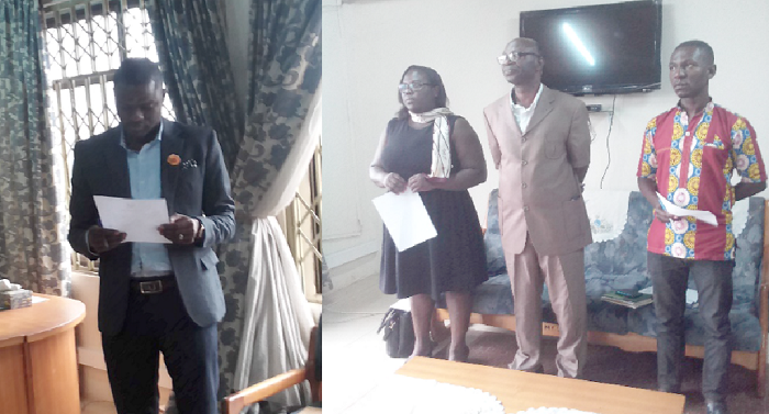 Mr Senanu Mensah (left) swearing in the audit committee members      