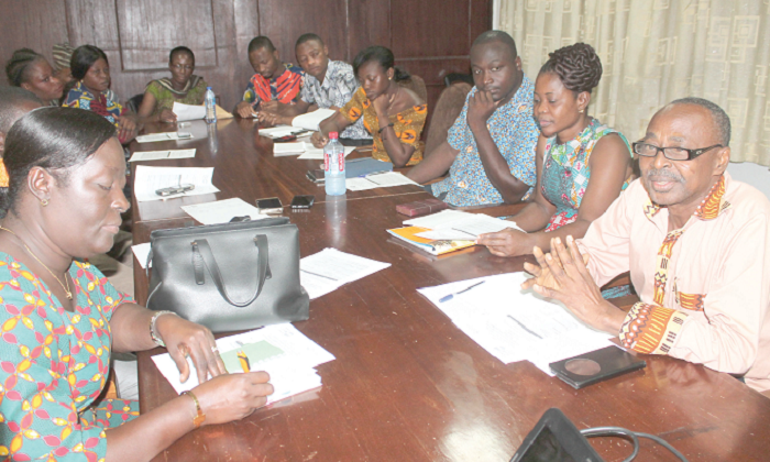 Mr Bawa Amadu (right), Assistant United Nations Population Fund (UNFPA) Representative, addressing participants in the meeting.