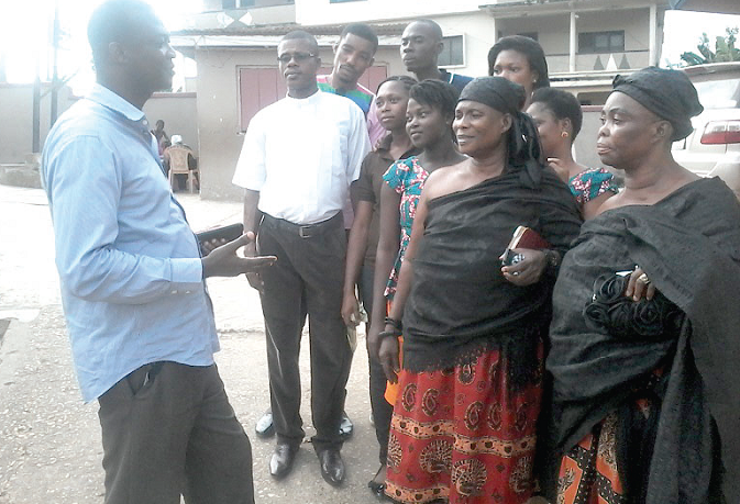  Superintendent Appiah Sakyi (left) explaining a point to some of the participants after the workshop