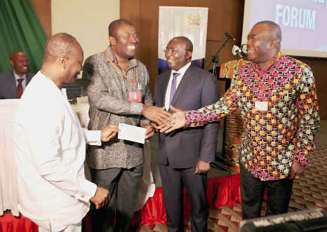 Nana Akomea (2nd left) presenting a cheque to Mr Ken Ofori-Atta (left), the Finance Minister, in the presence of Vice-President Mahamudu Bawumia.  On the right is Mr Stephen Asamoah-Boateng, the Executive Chairman of the State Enterprises Commission