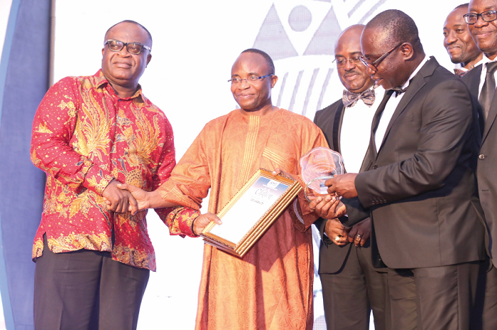 Mrs Josephine Okutu (left), Fellow of CIMG, presenting the Retail Outlet of the Year Award to Mr Godwin Avenogbor (2nd right), Director of Communication, Melcom Group of Companies. Mrs Josephine Okutu (left), Fellow of CIMG, presenting the Retail Outlet of the Year Award to Mr Godwin Avenogbor (2nd right), Director of Communication, Melcom Group of Companies.