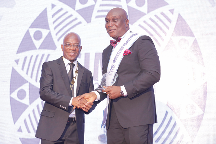Mr Kojo Mattah (left), National President of CIMG, presenting a plaque to Mr Clifford Mettle, Director, Marketing and Alternate Channels, UNIBANK for being the marketing practitioner of the year 2016. Mr Kojo Mattah (left), National President of CIMG, presenting a plaque to Mr Clifford Mettle, Director, Marketing and Alternate Channels, UNIBANK for being the marketing practitioner of the year 2016.