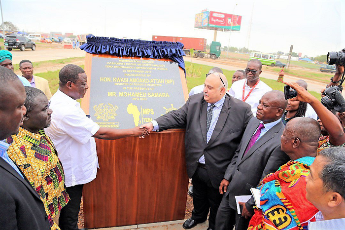 Mr Samara (2nd right) symbolically handing over the road to the Roads Minister, Mr Amoako Attah (in white shirt). With them are, Mr Kwaku Ofori-Asiamah (left), Transport Minister, and Mr Paul Ansah of GPHA.