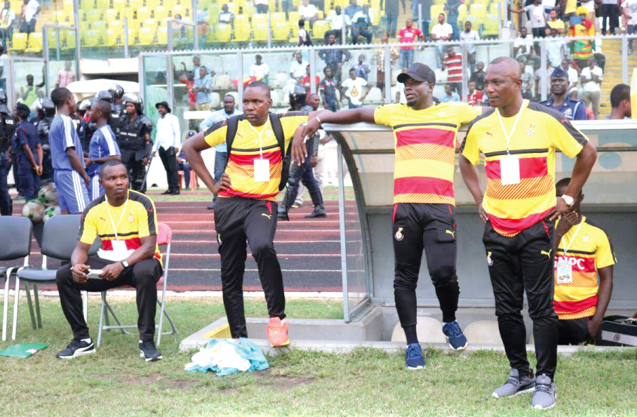 Coach Kwasi Appiah (right), Stephen Appiah (middle) and another member of his backroom team look dejected after the game with Congo