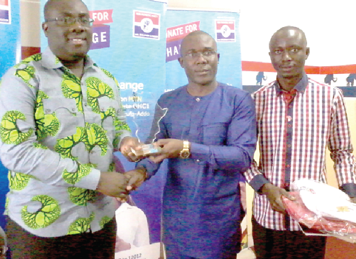 Mr Peter Kwasi Kodjie (middle), the Secretary General of AASU, handing over a shield to Mr Awuku. With them is Mr Ansumana B. Bojang, the Secretary, Press and Information, and an executive of the union. Picture: Nana Konadu Agyeman