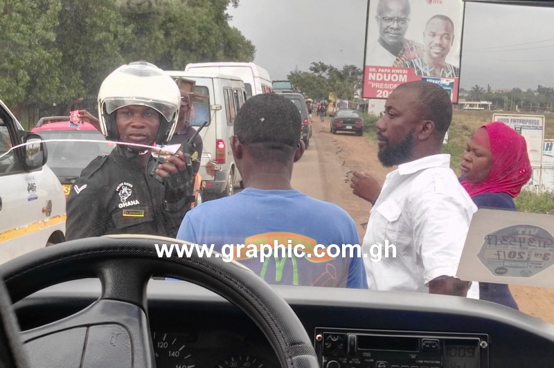The police dispatch rider, the driver (back to camera) and the couple