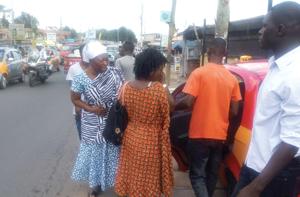 A woman (in white scarf) said to be the late mechanic’s mother crying on her way out of the court premises