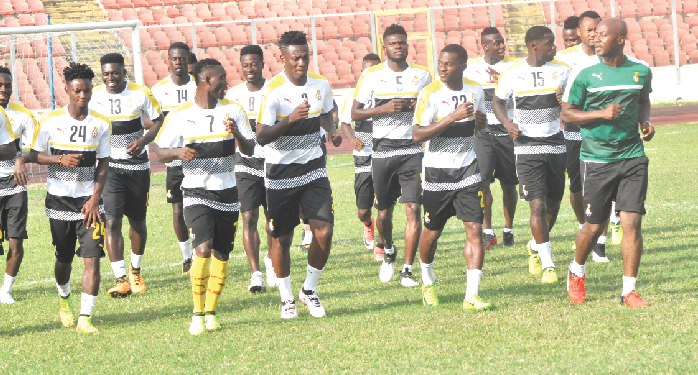 Asamoah Gyan (3rd left front row) leads the team during a training session.