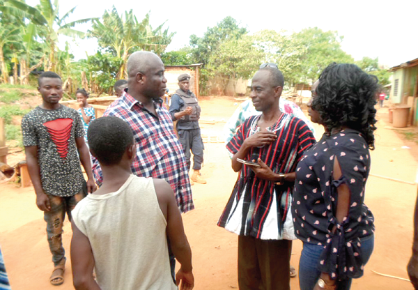 Mr Asiedu Nketiah and Dr Hanna Bissiw interacting with Mr Opoku during the visit