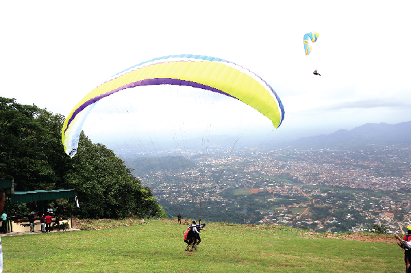 Paragliders taking off at the paragliding site at Atibie