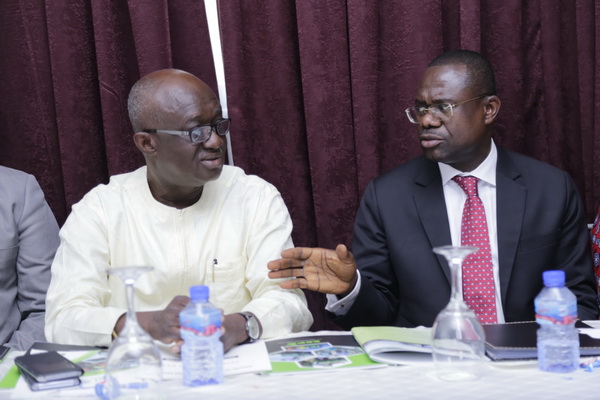 Mr Joseph Siaw Adjepong (right) interacting with Mr Joseph Kofi Adda after the AGM.