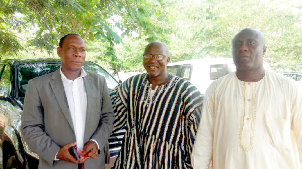 Mr Boateng flanked by his campaign attaches