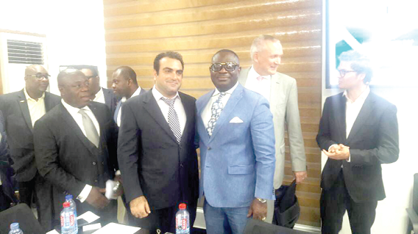 Mr Anthony Opoku (3rd right) with his business partners after the press briefing in Accra yesterday