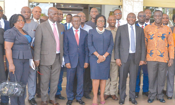 Vice-President Dr Bawumia (middle) flanked by Mrs Elsie Awadzie, 2nd Deputy Governor, Bank of Ghana, and Mr Ignatius Baffour Awuah, the Employment Minister, with stakeholders after the meeting