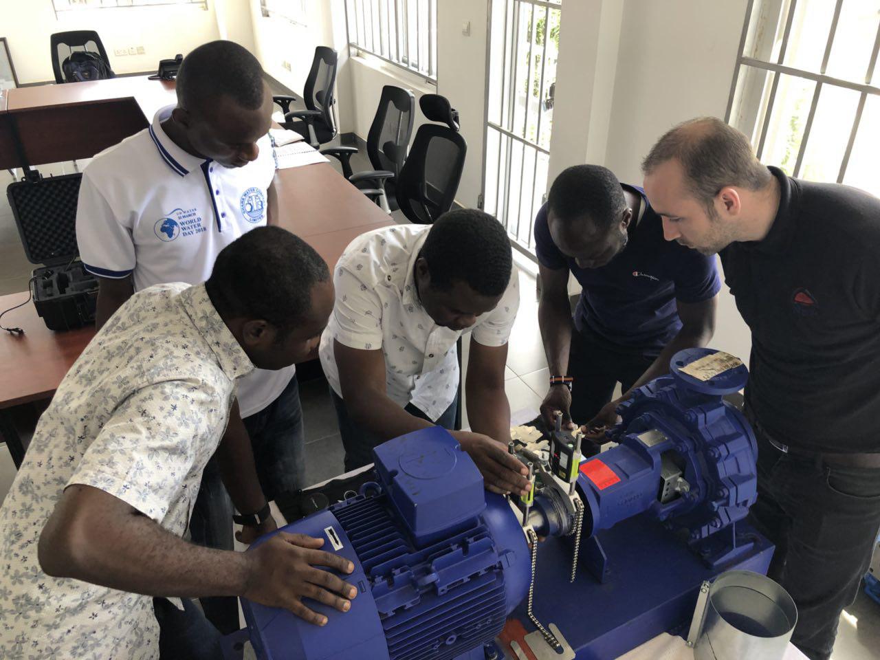 Benjamin Oliver (right) of Nicol and Andrew Plc from the United Kingdom taking the GWCL staff through how to use the laser kit