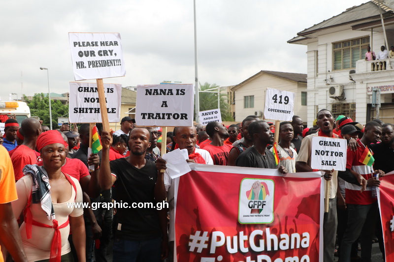 Demonstrators against the Ghana - US military pact bearing messages during the march