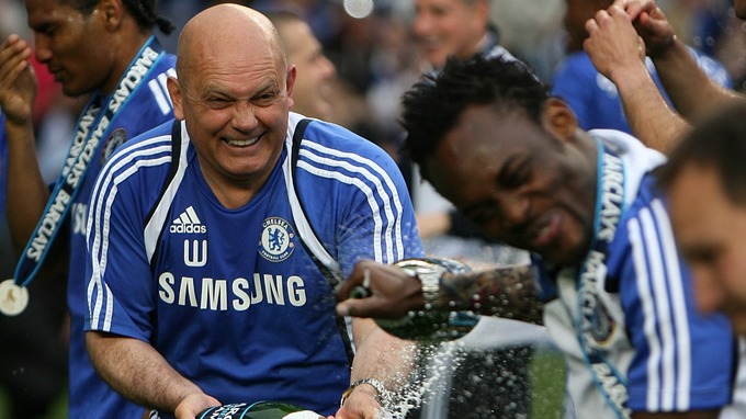 Ray Wilkins celebrating with Michael Essien after winning the Premier League in 2010.