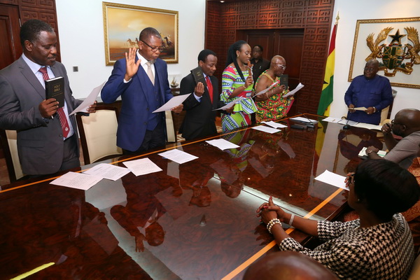 President Akufo-Addo swearing in board members of the Ghana International Trade Commission at the Jubilee House in Accra. 