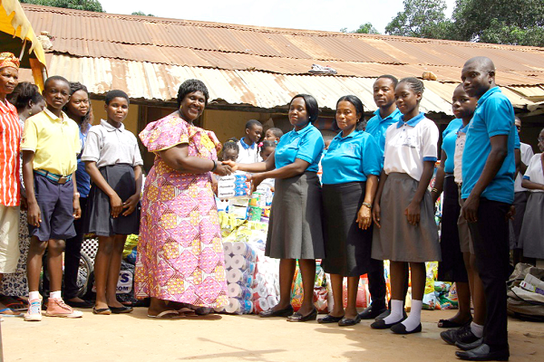 Ms Bertha Ansong (right), the Head of Administration of the Falsyd Foundation School, handing over the items to Dr Mrs Jane Irina Adu, the Founder and President of the Potter’s Village.