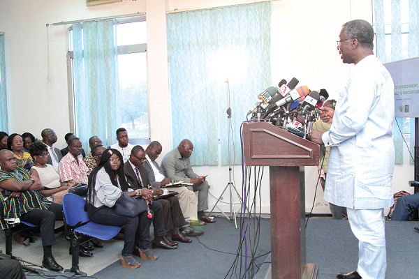 Prof. Kwabena Frimpong Boateng (right), Minister of Environment, Science, Technology and Innovation, delivering his presentation at the meet-the-press at the Information Ministry's Conference Room, Accra.