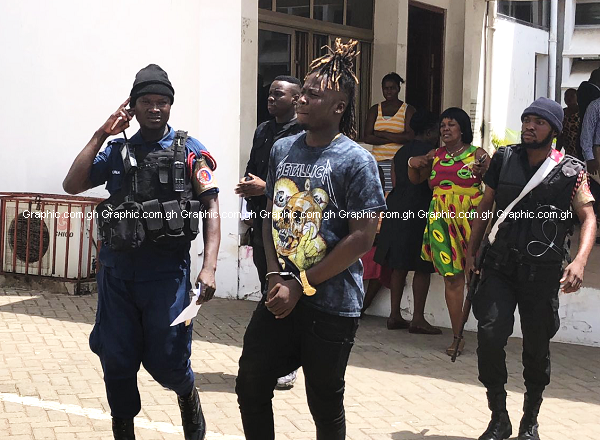 Wisa Greid being led away after he failed to pay the fine and also meet the bail term