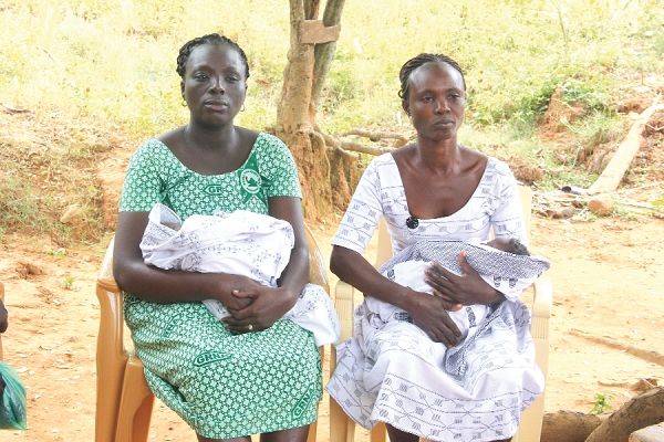 Mrs Elizabeth Krofa (left), a community nurse and Eunice Bruwa, a relative  of the mentally challenged woman carrying the twins. Picture: Maxwell Ocloo