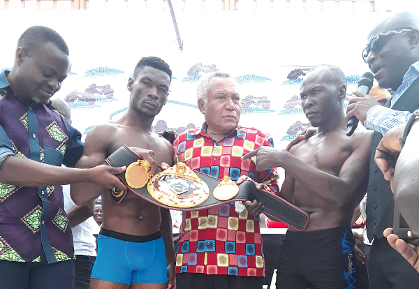Samir Captan sandwiched by Patrick Allotey (left) and Badru Lusambya (right)
