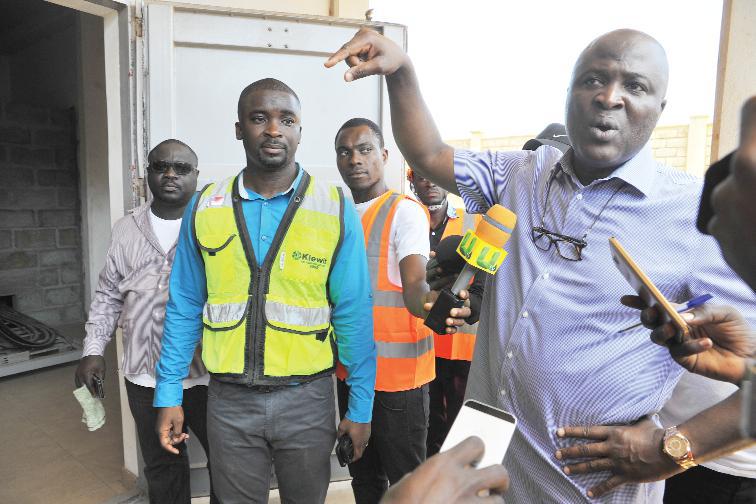 Mr Ibrahim Mahama (right) conducting the media round the facility in Tema
