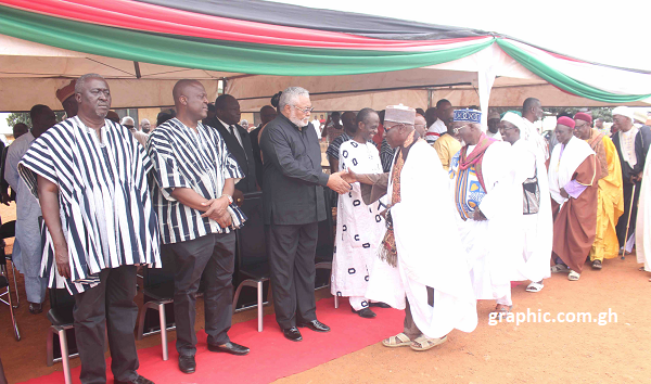 Former President Rawlings exchanging pleasantries with the family members of the late Alhaji Gado at the funeral grounds