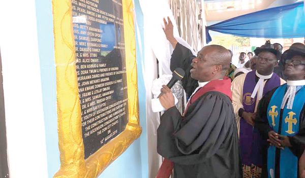 Rev. Ishmael Dometey Asare unveiling the plaque to officially open the new Presbyterian Church at Kwamoso (inset)