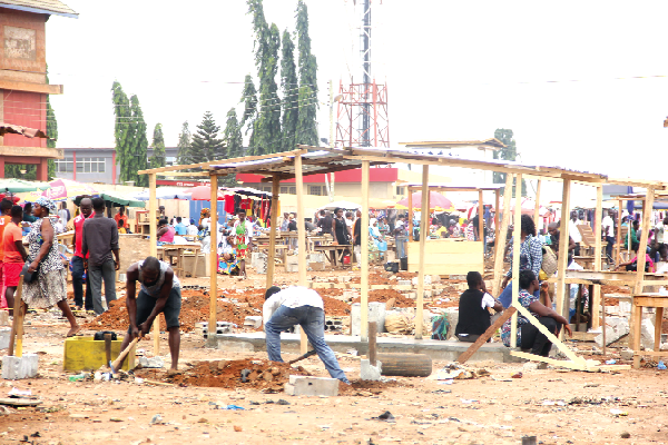 Some traders constructing structures for their wares at the Redco Market. Picture: Maxwell Ocloo