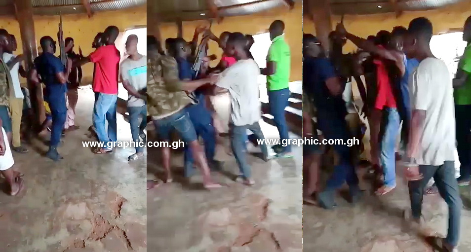 The youth struggling with the police man for his gun