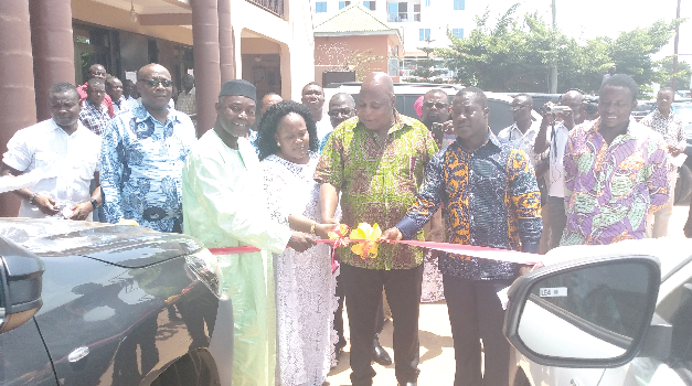  Alhaji Habib Saad (3rd left), MP for Bortianor-Ngleshie-Amanfro constituency and Mr Joseph Nyarni Stephen (2nd right), MCE for the Ga South Municipal Assembly, assisting Mr Ishmael Ashitey (3rd right), the Greater Accra Regional Minister, to cut the tape to commission the vehicles