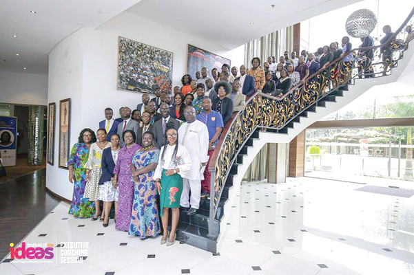 Speakers and participants in a group photograph