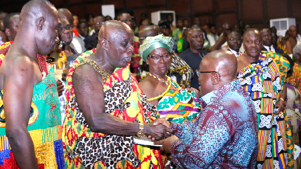 President Akufo-Addo presenting a copy of the book to Osagyefo Amoatia Ofori Panin (2nd left), the Okyenhene, after the lecture. Picture: SAMUEL TEI ADANO