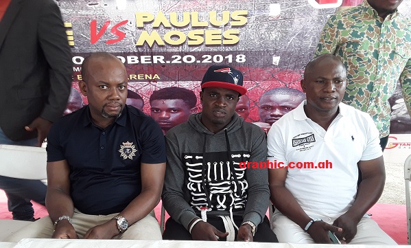 Emmanuel 'Gameboy' Tagoe flanked by Sammy Anim Addo (left) and his new trainer Adama Addy
