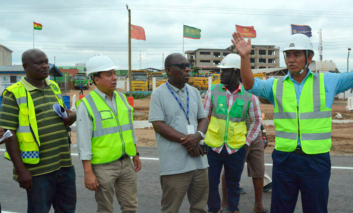 The Project Manager of Shimizu, Mr Uemura Yujin (right), explaining a point to Mr Yeboah (middle) and the Deputy MTTD Commander of Tema, ASP Bruce Amoah (left). Picture:DELLA RUSSEL OCLOO