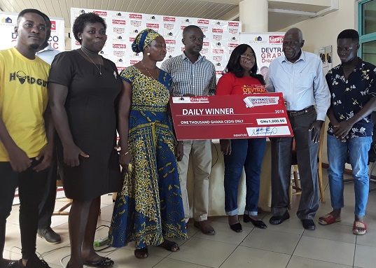 The pensioner, Adamo Tinga (2nd from right) receiving his prize from Eugenia McCready (3rd from right), Tema Graphic Manager. With them are family members and staff of Graphic.