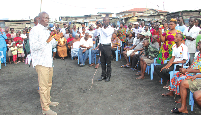 Nii Lante Vanderpuye (left), the MP of the Odododiodio Constituency, addressing some residents of Agbogbloshie during the meeting. Picture: EDNA ADU-SERWAA