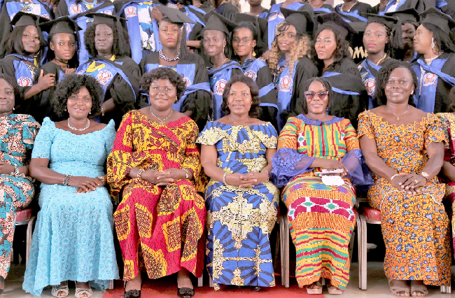 The graduating women with some dignitaries after the ceremony