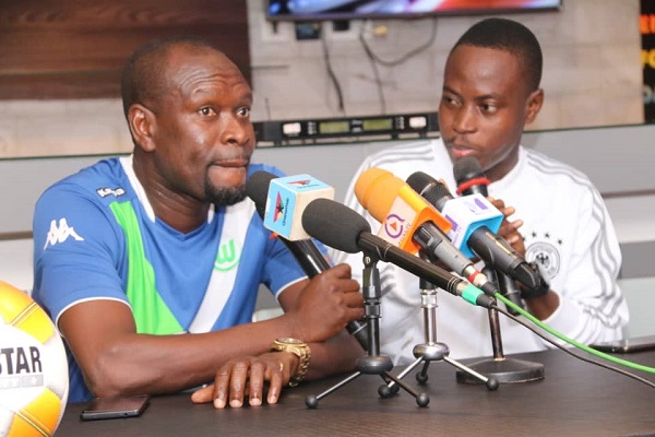 CK Akunnor (left) speaking to Eli Kondoh of StarTimes at the event.