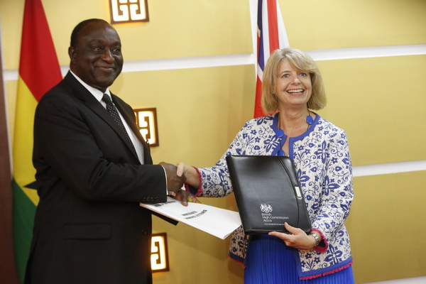 Mr Alan Kyerematen and Ms Harriet Baldwin  (right), UK Minister for Africa, exchanging documents after signing the MoU at the Jubilee House in Accra. Picture: SAMUEL TEI ADANO