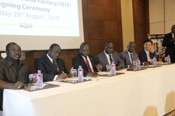 Mr Alan Kyeremateng (2nd left), the Minister of Trade and Industry and Mr William Oppong-Bio (4th left), the chairman, Central Sugar Company Limited, signing the memorandum of understanding. Mr John Awuah (3rd left), the Chief Executive Officer of Universal Merchant Bank (UMB), Mr Kojo Oppong-Nkrumah (5th left), Minister of Information designate, and other dignitaries witnessed the signing. Picture: EDNA ADU-SERWAA