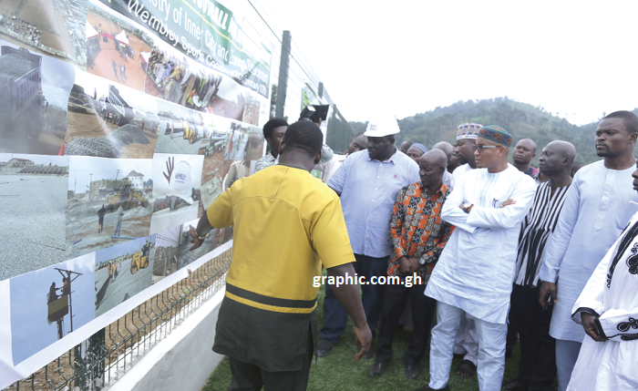 Dr Mustapha Abdul-Hamid (arrowed) and his team being briefed on some developmental projects in the areas they visited