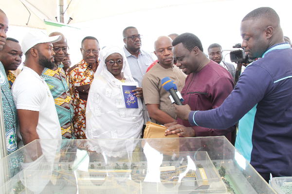 Dr Richard Amponsah (6th left), Managing Director, Accra Compost and Recycling Plant, explaining to Hajia Alima Mahama and other ministers how the recycling plant works. Picture: BENEDICT OBUOBI